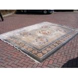 A large Middle Eastern style rug with geometric bo