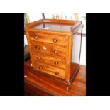 A small four drawer Wellington chest - 47cms high