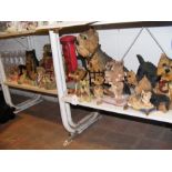 A quantity of dog ornaments - on two shelves