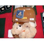 A modern Steiff teddy bear in suitcase together wi