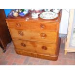 A Victorian three drawer mahogany chest