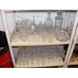 A collection of cut glass - on two shelves
