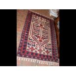 An old Middle Eastern rug with geometric border -