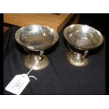 A pair of Arts & Crafts style hammered silver tazz