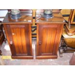 A pair of antique pot cupboards