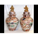 A pair of large antique oriental Imari vases with
