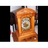 A 45cm high oak cased chiming mantel clock