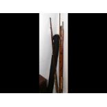 A selection of antique fly fishing rods, split can