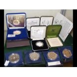 A selection of collectable silver and other commem