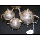 A decorative three piece Indian silver tea set, th
