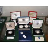 A selection of boxed commemorative coins