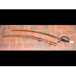 A 19th century cavalry sword in scabbard -