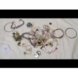 A collection of costume jewellery including bangle