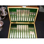 A cased set of fish knives and forks with engraved