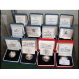 Twelve boxed silver proof coins
