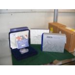 Four boxed commemorative crowns including 100th An