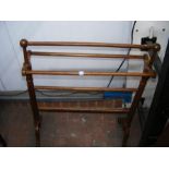 An antique towel rail with fluted support