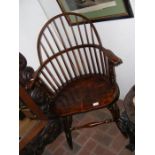 An antique stick-back country armchair