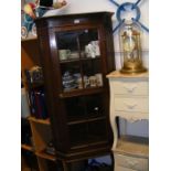 An oak corner display cabinet