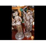 A pair of spelter figures depicting gentleman and
