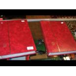 Two red 'lighthouse' stamp albums