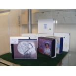 Four boxed commemorative silver proof crowns