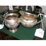 An Indian silver cream jug, together with a small