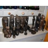 Assorted carved tribal heads and figures