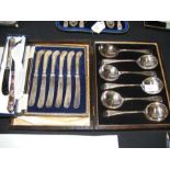 A cased set of soup spoons, silver handled butter