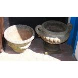 A concrete urn on plinth together with a concrete