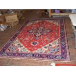 A Middle Eastern - North West Persian carpet with geometric border and centre