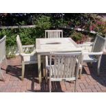 A teak 90cm square garden table with four matching