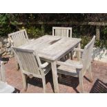 A teak 90cm square garden table with four matching