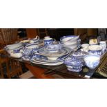 A quantity of 'Willow Tree' pattern blue and white