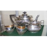 A four piece non matching silver tea set
