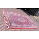 A large Middle Eastern carpet - 445cm x 303cm