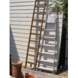 A vintage wooden ladder and an aluminium step ladd