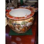 A decorative Chinese planter painted inside and ou