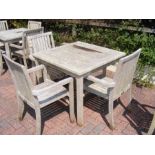 A teak 90cm square garden table with three matchin