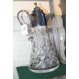 A silver mounted cut glass claret jug - 30cms high