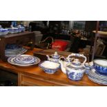A quantity of Willow pattern blue and white ware
