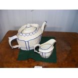 An antique Castleford teapot with milk jug
