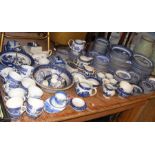A generous quantity of 'Willow Tree' pattern blue