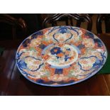 An antique Oriental Imari charger - diameter 55cms