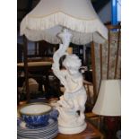 A large table lamp of cherub form