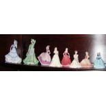 A collection of Coalport female figurines