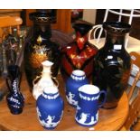 An assortment of vases, including three Adams vase