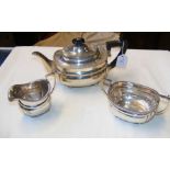 A three piece silver tea set with London hallmark