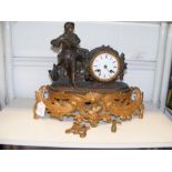 A cast metal continental mantel clock (requiring r