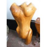 A modern wooden torso sculpture, standing 98cms hi